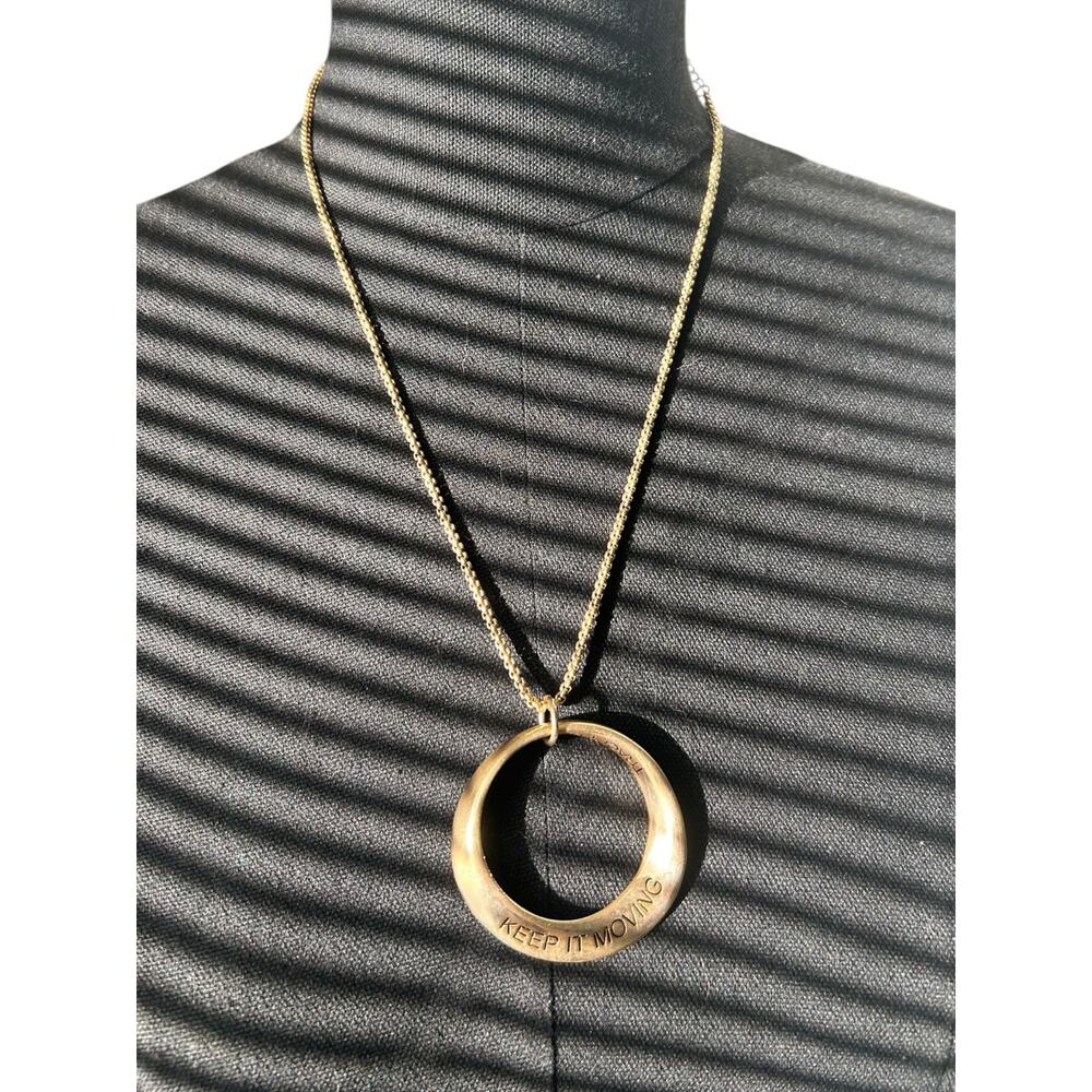 Traci Lynn Jewelry - "Keep It Moving" Statement Gold Tone Necklace 22” Chain